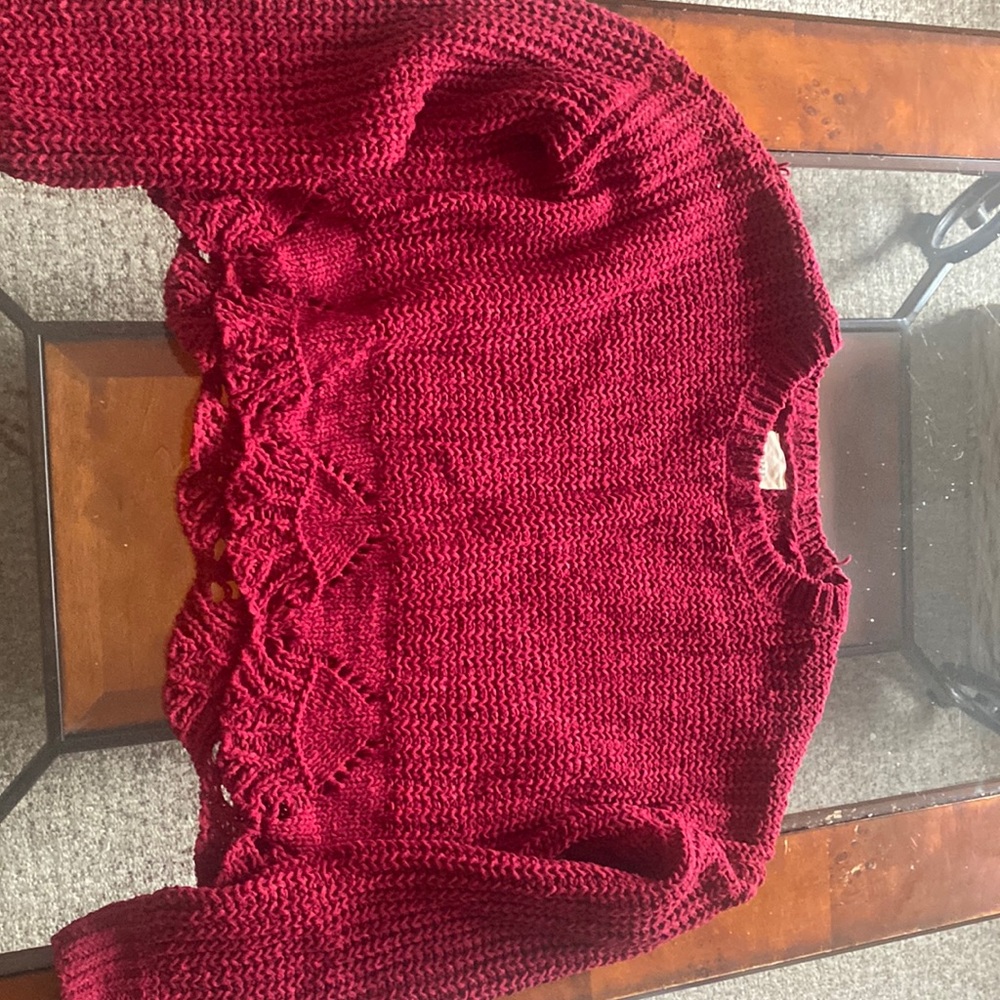 Pink crop sweater with fun detail along bottom